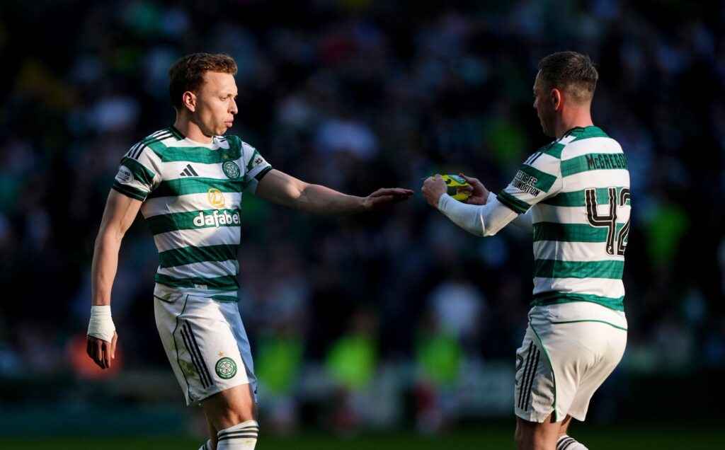 Celtic's Callum McGregor (right) gives the captain's arm band to Alistair Johnston as he leaves the pitch as he is substituted during the William Hill Premiership match at Celtic Park,