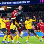 Wolverhampton, UK. 06th Mar, 2026. WOLVERHAMPTON, ENGLAND - MARCH 06: Goalkeeper Sam Johnstone of Wolves punches the ball away during the FA Cup football match between Wolverhampton Wanderers and Liverpool at Molineux stadium on March 06, 2026 in Wolverha